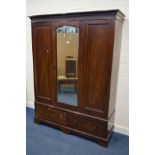 AN EDWARDIAN MAHOGANY MIRRORED SINGLE DOOR WARDROBE, above two deep drawers, width 154cm x depth