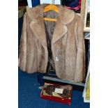 A MINK FUR SHORT JACKET with side pockets, length 62cm x width underarm to underarm 47cm and a