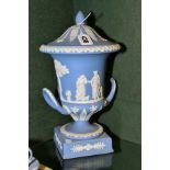 A WEDGWOOD PALE BLUE JASPERWARE TWIN HANDLED VASE AND COVER, on a square plinth base, height 29cm