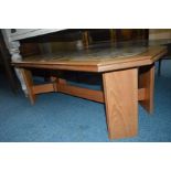 A 1980'S TEAK TILE TOP COFFEE TABLE with canted corners, width 116cm x depth 56cm x height 42cm