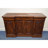 A VICTORIAN MAHOGANY INVERTED BREAKFRONT SIDEBOARD, with three frieze drawers above four cupboard