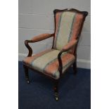 A VICTORIAN ROSEWOOD OPEN ARMCHAIR, with decorated scrolled armrests, on shaped front legs with