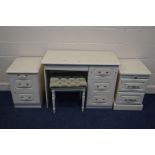 A MODERN WHITE DRESSING TABLE with three drawers, stool, matching bedside cabinet and another
