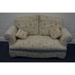 A FLORAL UPHOLSTERED TWO SEATER DOUBLE DROP END SETTEE, width 156cm