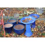 FOUR SIMILAR GLAZED GARDEN PLATERS (largest diameter 39cm) and two glazed bird baths (largest