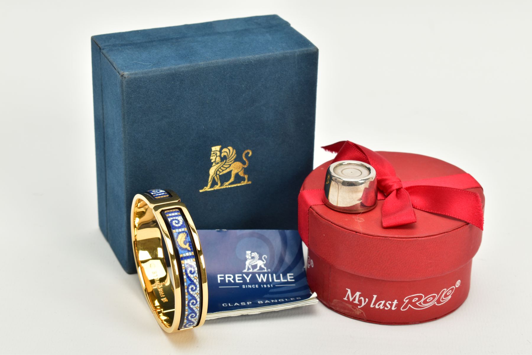 A SILVER ROLO KEEPSAKE AND AN ENAMEL FREY WILLE BANGLE, the cased silver Rolo engraved 'To Dave, for