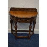 A REPRODUCTION OAK DEMI LUNE CONSOLE TABLE, with carved lunette decoration throughout, raised back