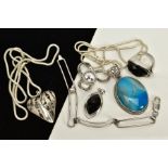 A SELECTION OF WHITE METAL JEWELLERY, to include an open work hollow heart pendant, suspended from a