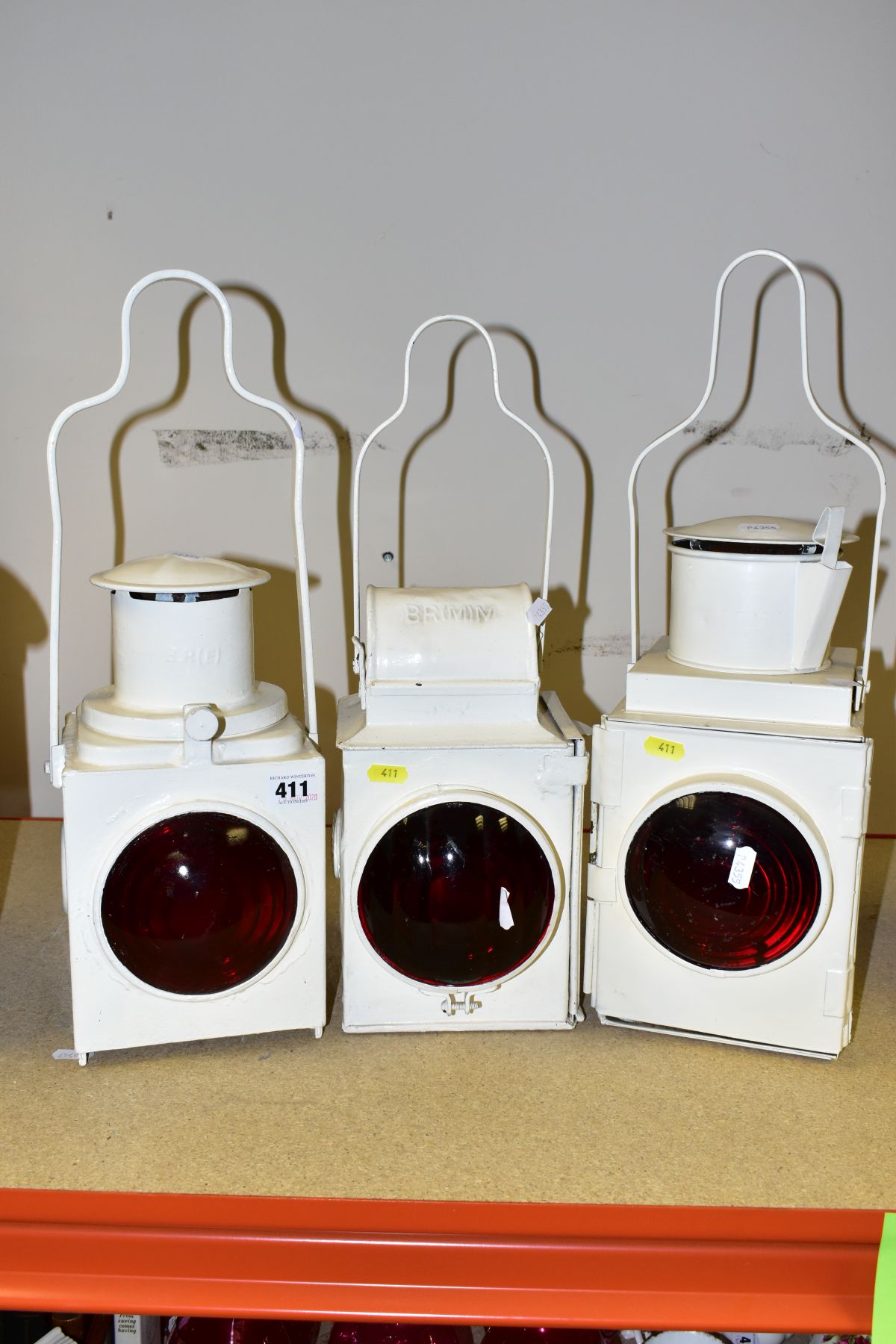 THREE BRITISH RAILWAYS TAIL LAMPS, red bullseye lenses to front, embossed B.R. (E), B.R. (M) or B.