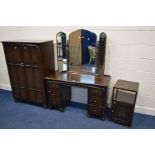 AN OAK LINENFOLD THREE PIECE BEDROOM SUITE, comprising a dressing table with a triple mirror, two