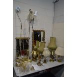 A QUANTITY OF VARIOUS LAMPS, to include seven brass table lamps, some with shades, three uplighters,