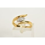 AN 18CT GOLD DIAMOND RING, of crossover design, set with a marquise cut diamond, colour assessed