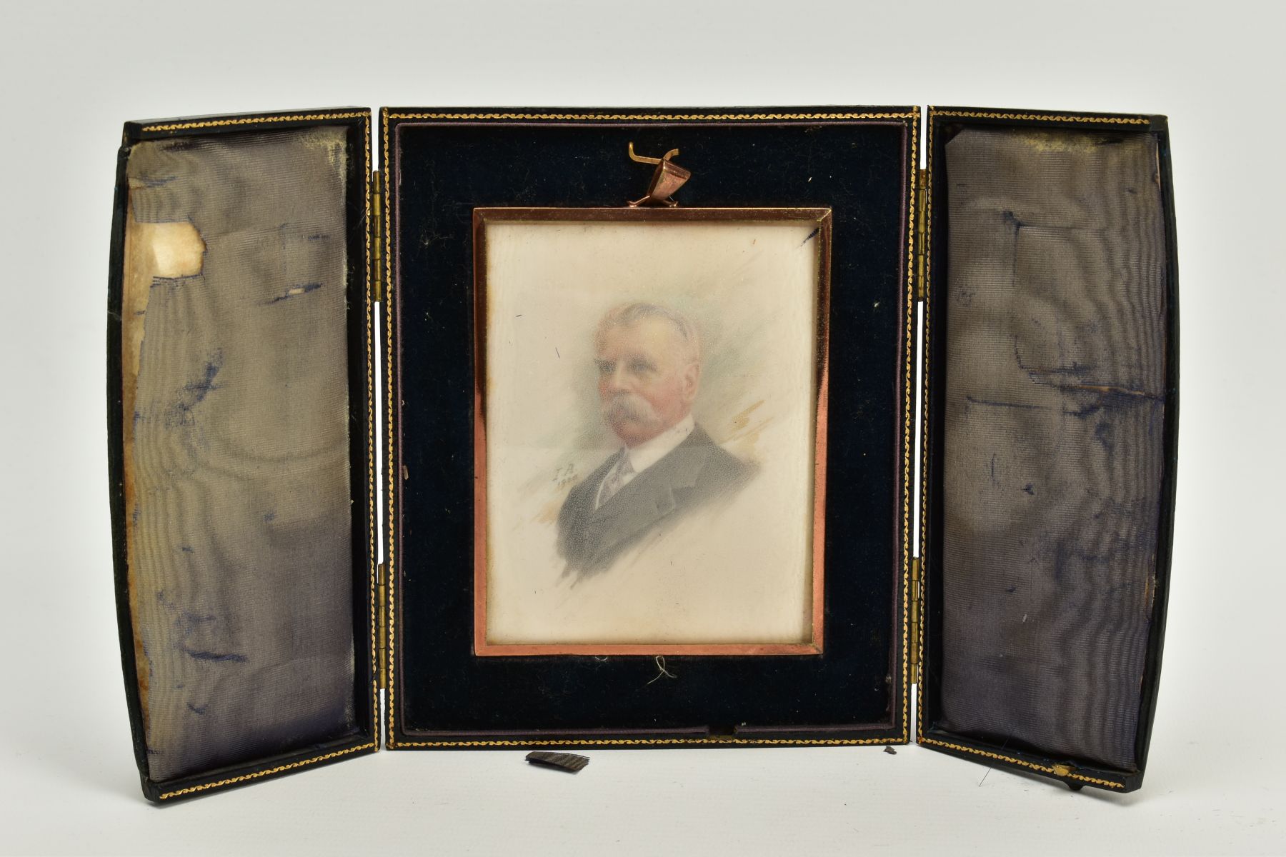 A CASED MINIATURE PORTRAIT, the blue and gold trim case, opens to reveal a miniature portrait of a