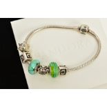 A PANDORA BRACELET WITH CHARMS, the snake chain bracelet, suspending six charms, such as two green