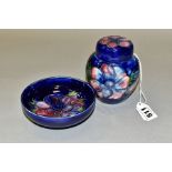 TWO MOORCROFT POTTERY ITEMS, 'Anemone' pattern on blue ground, a small ginger jar, height 10.5cm and