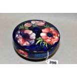 A MOORCROFT POTTERY CIRCULAR BOWL AND COVER, pink and purple anemone on a blue/green ground, some