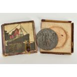 A CASED REPLICA R.M.S. LUSITANIA MEDALLION, commemorative medallion depicting the sinking of the '