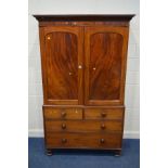 A GEORGIAN MAHOGANY LINEN PRESS, overhanging cornice, double panelled doors enclosing four linen