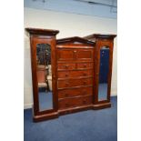 A VICTORIAN MAHOGANY COMPACTUM TRIPLE SECTION WARDROBE, the two outer sections with individual