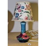 A MOORCROFT POTTERY TABLE LAMP OF BALUSTER FORM, red and purple anemone on a mottled green/blue back