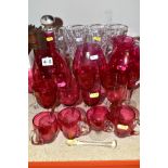 A GROUP OF CRANBERRY AND CLEAR GLASSWARE, including a decanter, three oversized brandy glasses,