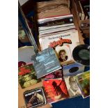 A BOX OF LP'S AND SINGLES RECORDS, the small quantity of singles include Buddy Holly and classical