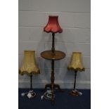 A PAIR OF EDWARDIAN MAHOGANY COLUMN TABLE LAMPS with fabric shades (one lamp with repair to base and