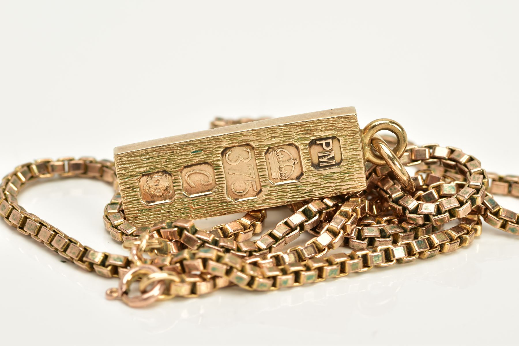 A 9CT GOLD INGOT AND CHAIN, the textured front ingot pendant, hallmarked 9ct gold London 1977, - Image 3 of 3