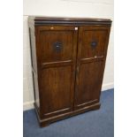 AN EARLY TO MID 20TH CENTURY OAK TWO DOOR GENTLEMANS WARDROBE, with a fitted interior, width 106cm x