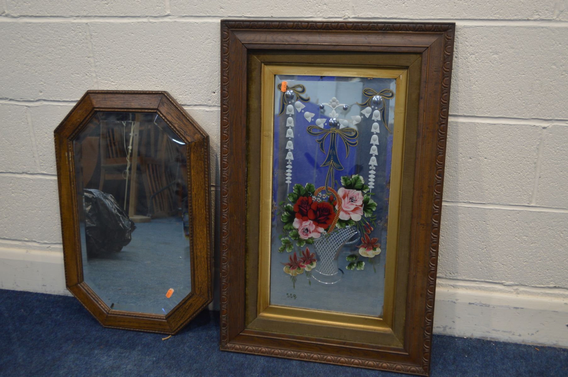 AN EARLY 20TH CENTURY OAK FRAMED GYPSIE MIRROR, 55cm x 86cm and another wall mirror with cantered