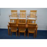 A MODERN VARNISHED PINE CROSS BANDED EXTENDING DINING ROOM TABLE on block tapering square legs