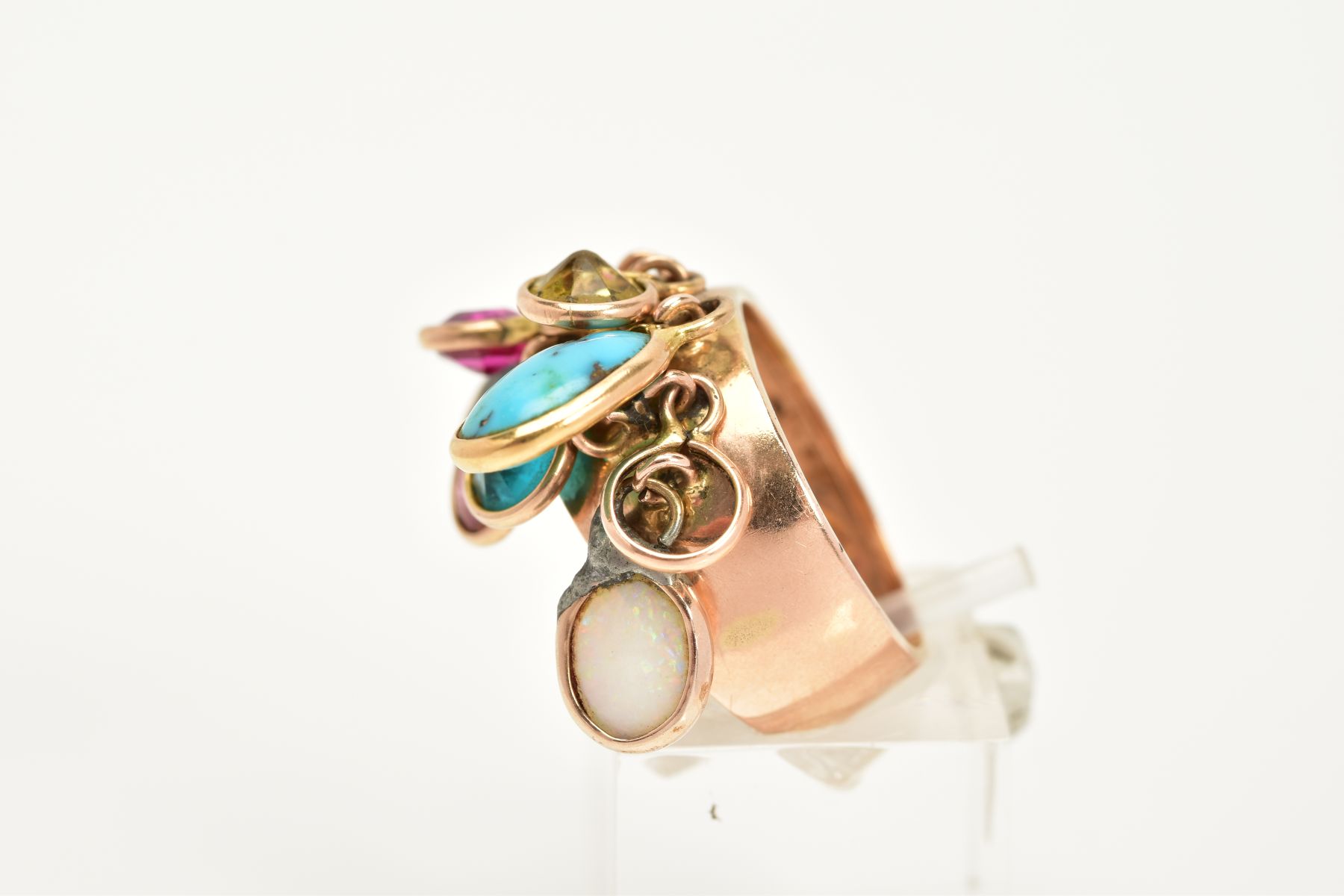 A YELLOW METAL MULTI-GEMSTONE RING, the plain polished wide shank, suspends nine drops containing - Image 2 of 4