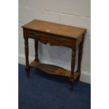 AN EDWARDIAN OAK HALL TABLE with two drawers on turned legs united by a shaped undershelf, width