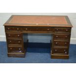 A MID TO LATE 20TH CENTURY WALNUT FINISH PEDESTAL DESK, with a tan leather and gilt tooled inlay