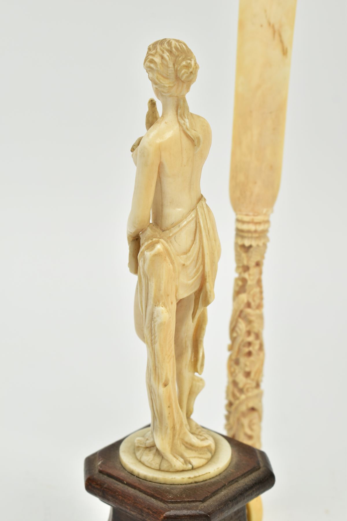 A 19TH CENTURY CARVED IVORY FIGURE OF A SCANTILY CLAD FEMALE WITH A BIRD AND PIPES, mounted on a - Image 6 of 9