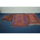A TEKKE RED GROUND RUG, with multi strap border, 199cm x 127cm together with a bokara ground rug