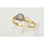 AN 18CT GOLD SINGLE STONE DIAMOND RING, designed with an illusion set round brilliant cut diamond,