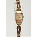 A 9CT GOLD LADYS HAND WOULD 'AVIA' COCKTAIL WRISTWATCH, the rectangular case with a square cream