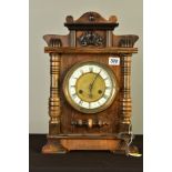 A LATE 19TH CENTURY WALNUT CASED MANTEL CLOCK, rectangular outline with moulded pediment, enamel