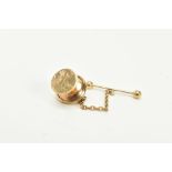 A 9CT GOLD TIE TACK, with a floral engraved design to the front, fitted with a safety chain and T-