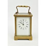 A FRENCH BRASS GLASS SIDED CARRIAGE CLOCK, white dial with Roman numerals, measuring approximately