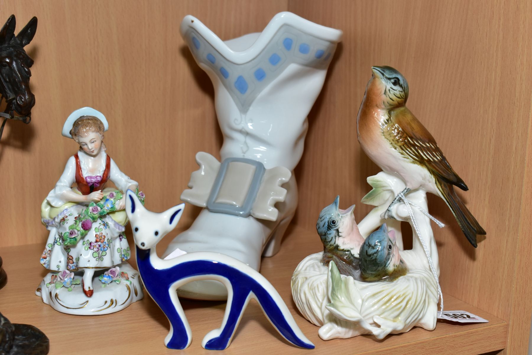 A KARL ENS VOLKSTEDT-RUDOLSTADT PORCELAIN FIGURE GROUP, depicting bird feeding chicks in a nest,