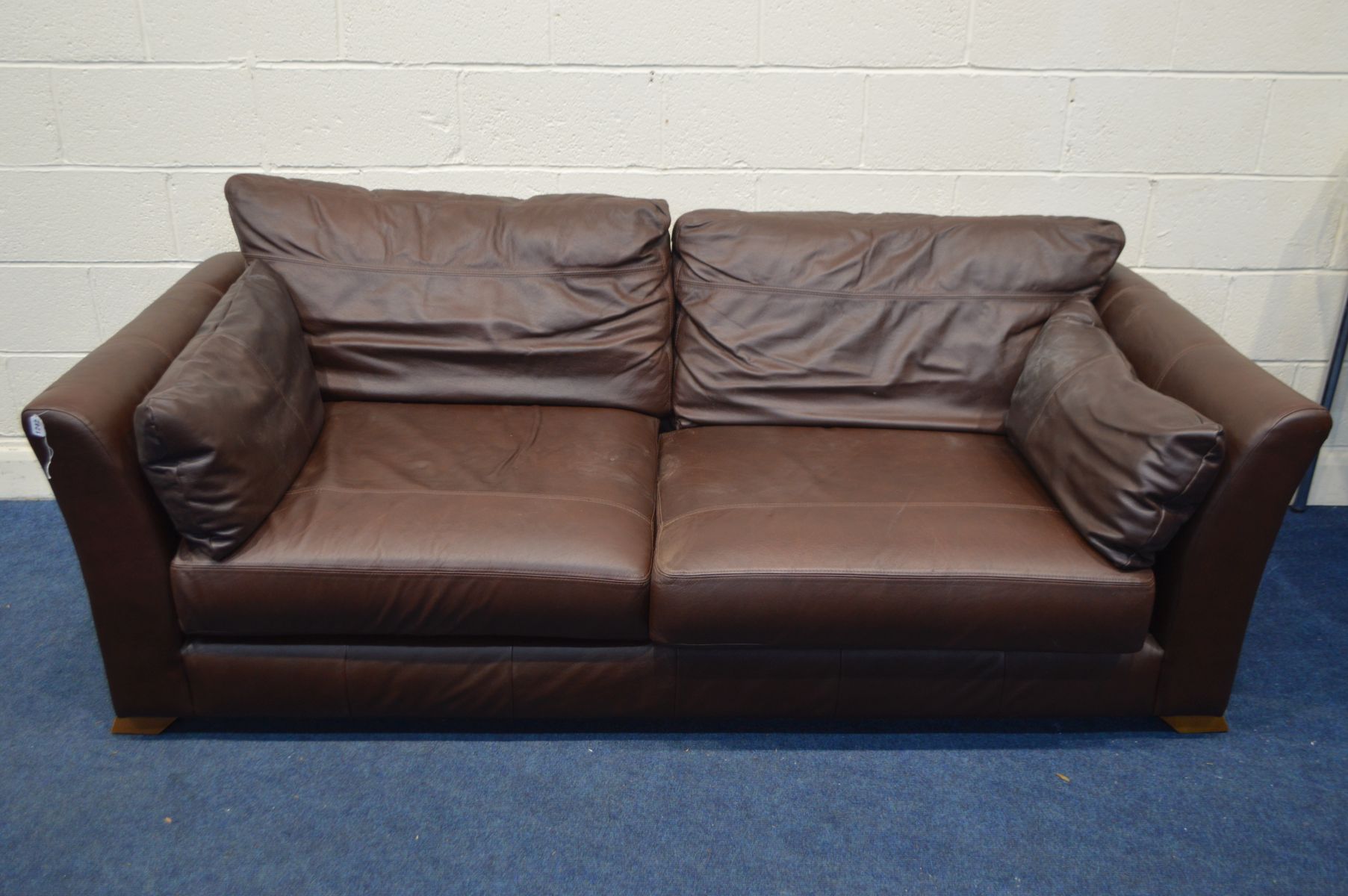 A MARKS AND SPENCERS BROWN LEATHER THREE SECTION SETTEE, width 130cm x depth 96cm x height 68cm