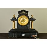 AN EARLY 20TH CENTURY BLACK SLATE AND GILT METAL MANTEL CLOCK OF ARCHITECTURAL FORM, the gilt