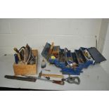 A METAL TOOL BOX AND A CARPENTERS TOOL TRAY containing hand tools, sockets, spanners, chisels,