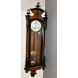 A LATE 19TH CENTURY WALNUT AND EBONISED CASED VIENNA REGULATOR WALL CLOCK, the wavy pediment with