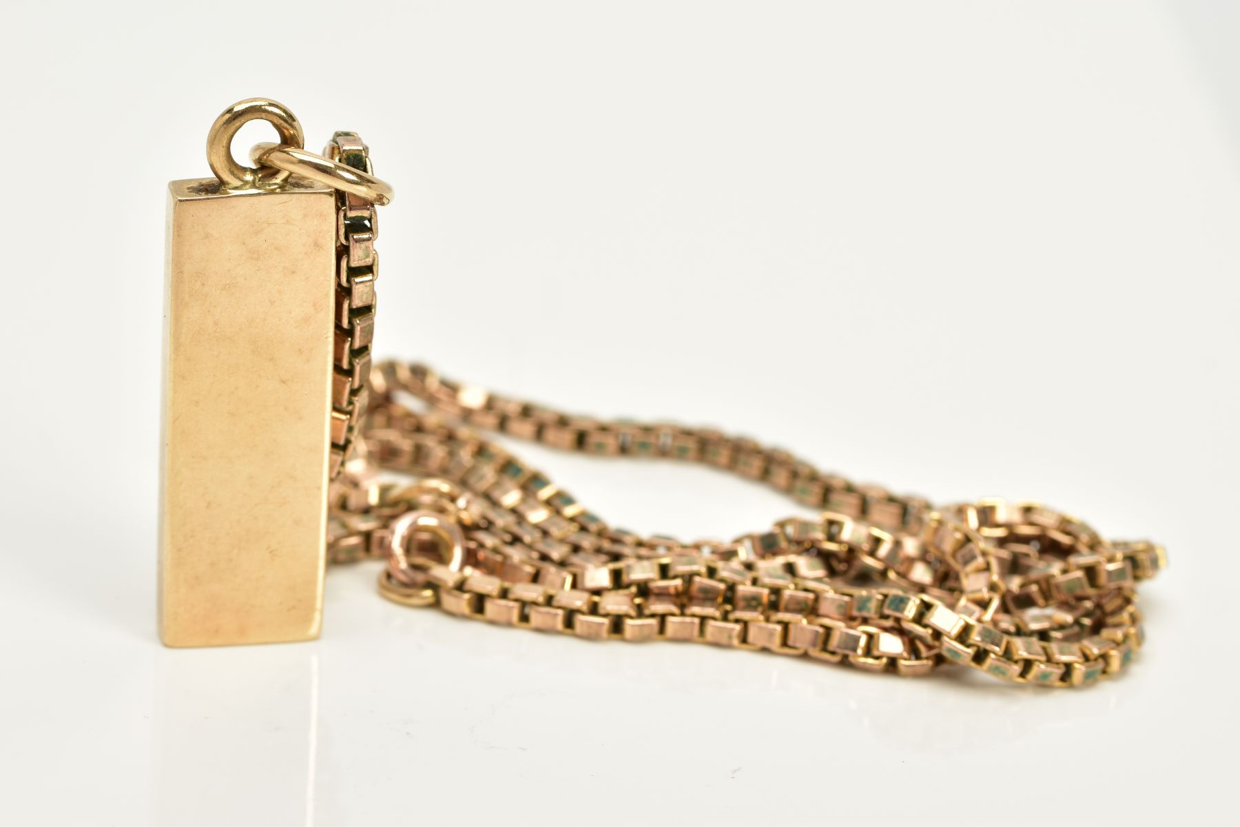 A 9CT GOLD INGOT AND CHAIN, the textured front ingot pendant, hallmarked 9ct gold London 1977, - Image 2 of 3
