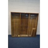 A BESPOKE OAK TRIPLE SECTION BOOKCASE with double glass sliding doors and adjustable shelves,