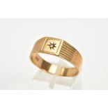 A 9CT GOLD GENTS SIGNET RING, the wide band with a central star set single cut diamond, to the