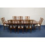 A MODERN MAHOGANY AND CROSSBANDED EXTENDING TWIN PEDESTAL DINING TABLE (two leaves), open width